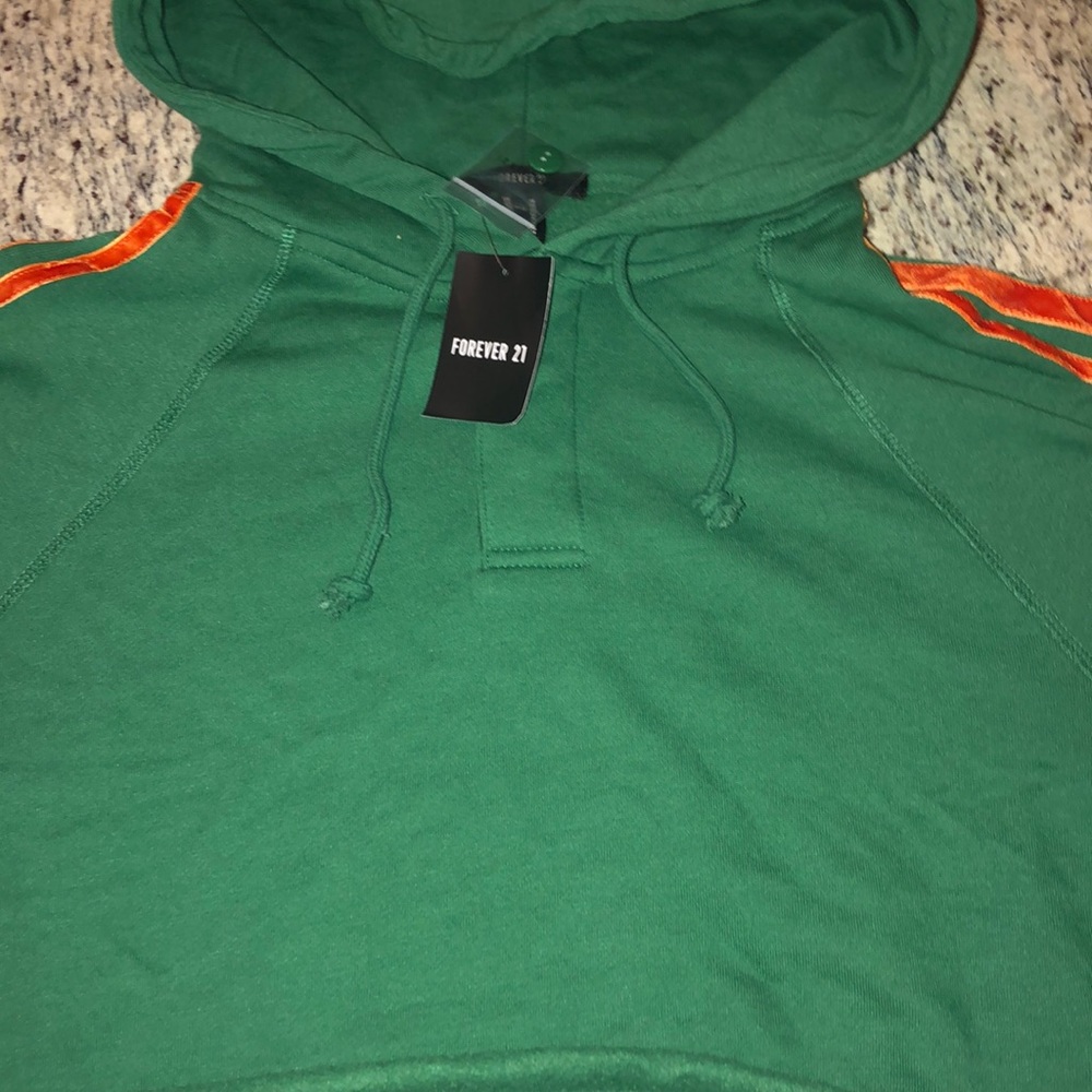 A green cropped hoodie